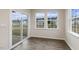Bright sunroom with sliding glass door and hardwood floors at 155 Scenic Rock Dr, Youngsville, NC 27596