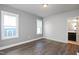 Spacious bedroom with grey walls, hardwood floors and access to a full bathroom at 1549 Piney Fls Dr, Wendell, NC 27591