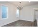 Elegant dining room featuring hardwood floors and a modern chandelier at 1549 Piney Fls Dr, Wendell, NC 27591