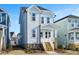 Two-story light blue house with white trim and wooden steps at 1549 Piney Fls Dr, Wendell, NC 27591