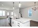 Kitchen with white cabinets, granite countertops and island at 1549 Piney Fls Dr, Wendell, NC 27591
