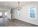 Bright and spacious living room with hardwood floors and a staircase at 1549 Piney Fls Dr, Wendell, NC 27591