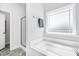 Bathroom with soaking tub, shower, and tile floor at 168 Northwood Dr, Fuquay Varina, NC 27526