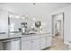 Open concept kitchen with large island, stainless steel appliances, and view into Gathering room at 168 Northwood Dr, Fuquay Varina, NC 27526