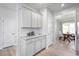 Kitchen with light cabinets, granite countertops, and access to dining area at 168 Northwood Dr, Fuquay Varina, NC 27526