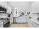 Modern kitchen with stainless steel appliances and granite countertops at 168 Northwood Dr, Fuquay Varina, NC 27526