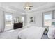 Spacious main bedroom with tray ceiling, large windows, and plush carpet at 168 Northwood Dr, Fuquay Varina, NC 27526