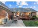 Brick home with a spacious deck, patio, and grilling area at 1991 Webster Grove Dr, Mebane, NC 27302