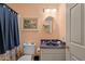 Clean bathroom with a blue vanity and shower/tub combo at 1991 Webster Grove Dr, Mebane, NC 27302