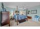 Well-lit bedroom with a four-poster bed and a dresser at 1991 Webster Grove Dr, Mebane, NC 27302