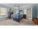 Cozy bedroom with a four-poster bed and plenty of natural light at 1991 Webster Grove Dr, Mebane, NC 27302