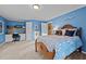 Spacious bedroom with desk and a wooden bed frame at 1991 Webster Grove Dr, Mebane, NC 27302
