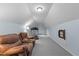 Bonus room with a treadmill and a brown recliner at 1991 Webster Grove Dr, Mebane, NC 27302