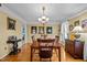 Formal dining room with hardwood floors, chandelier, and built-in hutch at 1991 Webster Grove Dr, Mebane, NC 27302