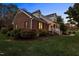 Brick home with landscaped yard and walkway at 1991 Webster Grove Dr, Mebane, NC 27302