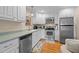 Updated kitchen with stainless steel appliances and ample cabinet space at 1991 Webster Grove Dr, Mebane, NC 27302