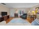 Bright living room with hardwood floors, comfy seating, and large windows at 1991 Webster Grove Dr, Mebane, NC 27302