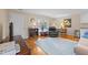 Living room features hardwood floors, a comfortable recliner, and large windows at 1991 Webster Grove Dr, Mebane, NC 27302