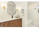 Stylish bathroom with modern vanity, a bathtub, and elegant fixtures at 2405 Lane St St, Durham, NC 27707