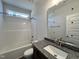 Bathroom with a granite countertop vanity and a shower-tub combination at 286 Longbow Dr, Middlesex, NC 27557