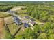 Overhead view of houses nestled between lush, mature trees offering a serene setting at 298 Hannah Yam Ln, Benson, NC 27504