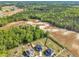 Expansive aerial view showcasing the neighborhood homes with lush green surroundings at 298 Hannah Yam Ln, Benson, NC 27504