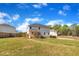 Fenced backyard view of the home's exterior with covered patio and neighboring houses at 298 Hannah Yam Ln, Benson, NC 27504