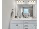 A bathroom featuring dual sinks with stylish fixtures, countertop space, and white cabinets at 298 Hannah Yam Ln, Benson, NC 27504