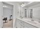 Bathroom featuring a double sink vanity and a large mirror with bright lighting at 298 Hannah Yam Ln, Benson, NC 27504