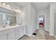 Bright bathroom featuring a dual vanity with white cabinets and a tile floor at 298 Hannah Yam Ln, Benson, NC 27504