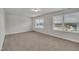 Spacious bedroom with two windows providing plenty of natural light and neutral carpeting at 298 Hannah Yam Ln, Benson, NC 27504