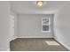 Bedroom featuring neutral walls, carpeted floors, and a bright window offering natural light at 298 Hannah Yam Ln, Benson, NC 27504