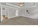 A spacious bedroom features neutral paint and carpet with a modern ceiling fan at 298 Hannah Yam Ln, Benson, NC 27504