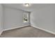 Bedroom featuring plush carpet and a window with backyard views for a tranquil setting at 298 Hannah Yam Ln, Benson, NC 27504
