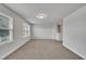 Large bonus room filled with light and neutral paint throughout, perfect for a home office or playroom at 298 Hannah Yam Ln, Benson, NC 27504