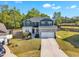 Two-story home featuring gray and white siding, a gray roof, and a two-car garage at 298 Hannah Yam Ln, Benson, NC 27504