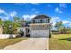Two-story home with blue and white siding, complemented by a well-maintained lawn and driveway at 298 Hannah Yam Ln, Benson, NC 27504