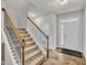 Welcoming foyer featuring hardwood floors, staircase, and a front door with glass accents at 298 Hannah Yam Ln, Benson, NC 27504