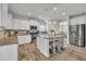 Well-equipped kitchen with stainless steel appliances, granite countertops, and a breakfast bar at 298 Hannah Yam Ln, Benson, NC 27504
