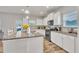 Open concept kitchen with granite countertops, stainless steel appliances, and white cabinetry at 298 Hannah Yam Ln, Benson, NC 27504