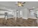 Open concept living space with an island kitchen and staircase at 298 Hannah Yam Ln, Benson, NC 27504