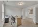 Well-lit office with a wooden desk, office chair, and printer on a filing cabinet at 298 Hannah Yam Ln, Benson, NC 27504