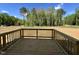New back deck overlooks spacious private backyard and mature trees, perfect for relaxing outdoors at 302 Longbow Dr, Middlesex, NC 27557
