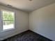 Bedroom featuring plush carpeting, a window with natural light, and a neutral color scheme at 302 Longbow Dr, Middlesex, NC 27557