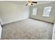 Bright bedroom with neutral carpeting and ceiling fan at 311 Gladstone Dr, Durham, NC 27703