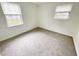 Simple bedroom with carpet and two windows at 311 Gladstone Dr, Durham, NC 27703