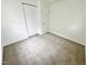 Simple bedroom with neutral carpeting and closet at 311 Gladstone Dr, Durham, NC 27703