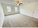 Spacious bedroom with neutral carpeting and two windows at 311 Gladstone Dr, Durham, NC 27703