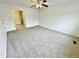 Well-lit bedroom with carpet flooring and two doors at 311 Gladstone Dr, Durham, NC 27703
