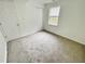 Well-lit bedroom with carpet, window and closet at 311 Gladstone Dr, Durham, NC 27703